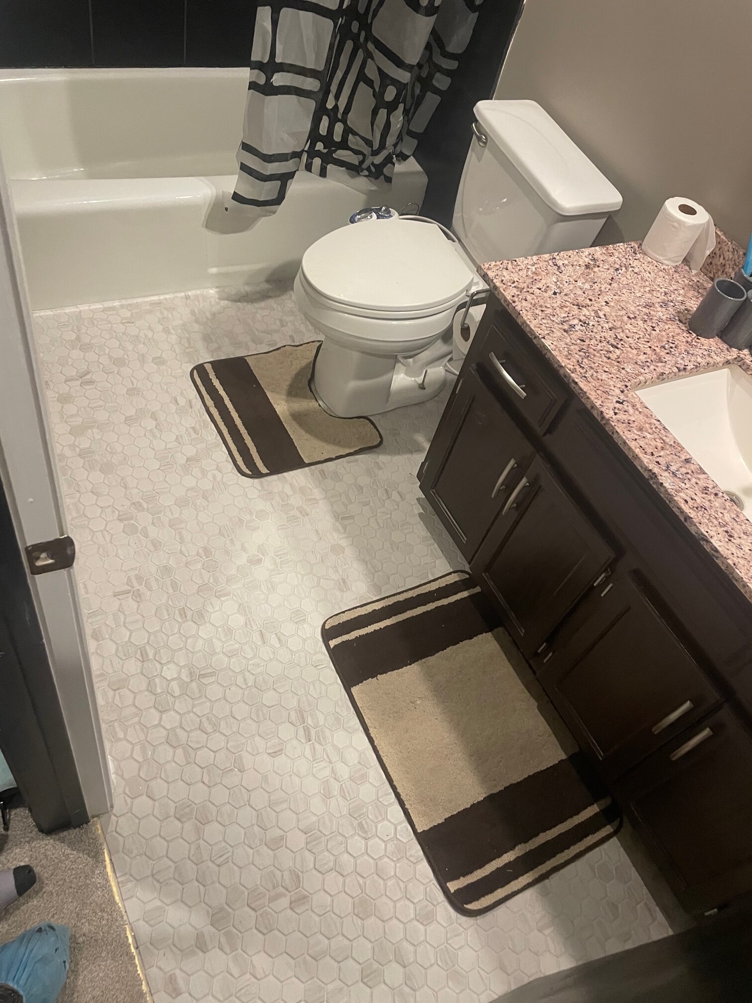 Same bathroom with new white hex tile floor, completed by Restor KC