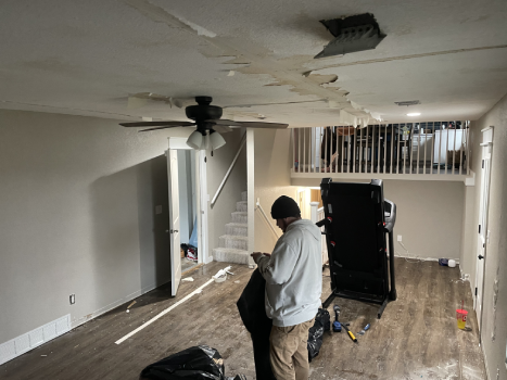 Water-damaged, sagging living room ceiling before Restor KC repairs